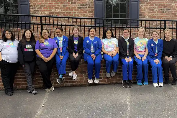 Salisbury Pediatric Dentistry's staff sitting in front of the office at  NC Pediatric Dentistry 