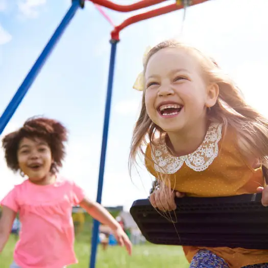 Two girls playing in park