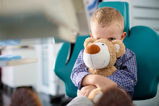 Nervous young boy in dental chair