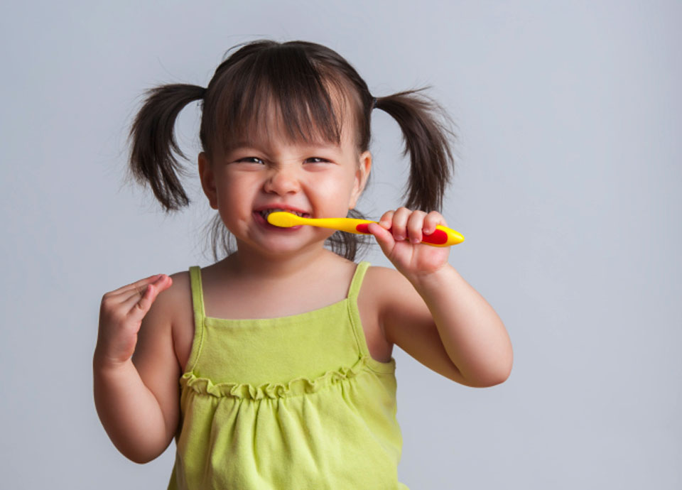 Little Girl Brushing Teeth at Nearby NC Pediatric Dentist